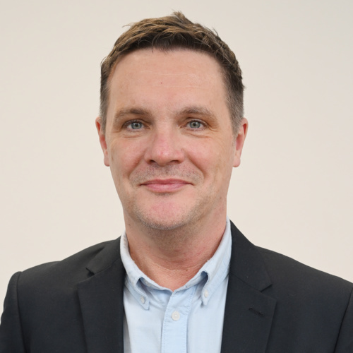 A portrait photo of Craig McClue